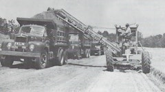 One advantage of a motor grader/EGA outfit was that it required only one operator. But in some loading situations, a spotter rode out on the parent’s frame to direct hauler traffic, somewhat negating the labor savings. Courtesy: Ulrich Manufacturing Company Form 1231, n. d., HCEA Archives