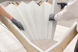 Unfold Form consists of a plywood sheet cut into individual curved strips with textile layers applied to one side to connect them. The plywood strips can be unfolded like a fan on site, causing them to bend into shape.