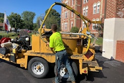 Pave Care employee Christian Shaffer crack sealing for a paving project at Eire Veterans Home.