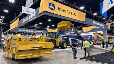 Only a few minutes after the show has ended, and people are already hard at work tearing up carpet, and removing equipment.