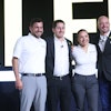 Brian Weisbaum (second from left) poses at the 2025 New Holland Construction National Dealer Meeting, where he outlined his vision for strengthening dealer relationships and expanding digital retailing.