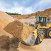 John Deere's new 824 X-Tier loader features the John Deere Electric Variable Transmission (EVT) E-Drive system. It is equipped with a JD9 diesel engine as the primary power source, however, the torque converter and traditional transmission have been replaced by the EVT system. In addition, the E-Drive component provides instant power, while simplifying operation and reducing complexity.
