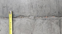 Joint edge spalling occurs when the joint filler is no longer protecting the joint edges and by rocking joints associated with slab curling that exposes edges to wheel impacts.