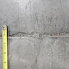Joint edge spalling occurs when the joint filler is no longer protecting the joint edges and by rocking joints associated with slab curling that exposes edges to wheel impacts.