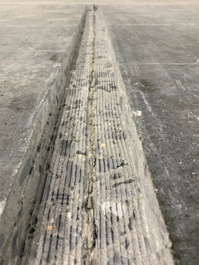 A concrete joint widened for structural repair.