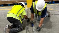 Concrete contractors widened a structural joint for repair.
