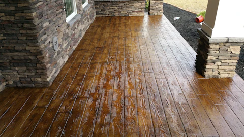 Stamped concrete mimicking natural wood delivers the look of timber with the durability of concrete.
