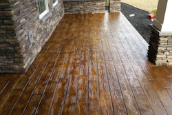 Stamped concrete mimicking natural wood delivers the look of timber with the durability of concrete.