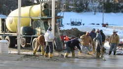 Maintaining proper mix temperature with preheated water and aggregates prevents early freezing and promotes reliable strength gain.