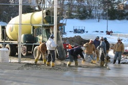 Maintaining proper mix temperature with preheated water and aggregates prevents early freezing and promotes reliable strength gain.