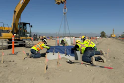 Contractors setting a precast concrete base at the Greenlane Center site in Colton, California.