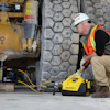 Enerpac XC2 battery powered pump makes quick work of jacking construction and mining vehicles.