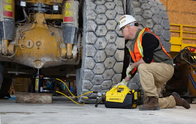 Enerpac XC2 battery powered pump makes quick work of jacking construction and mining vehicles.