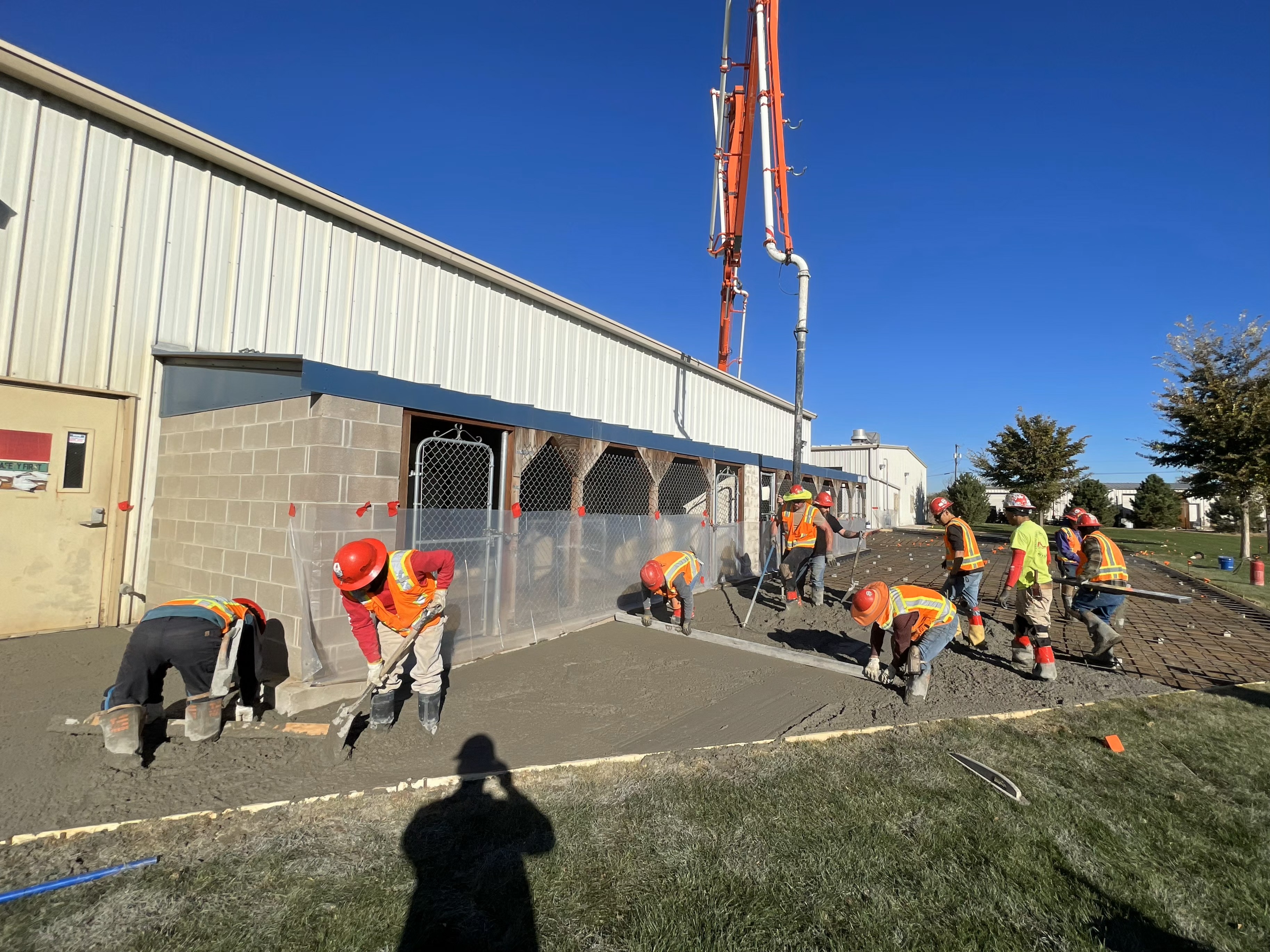 Dan Baker, high-vis sun shade on the hard hat, at a concrete placement by ICM in Denver, Colorado.