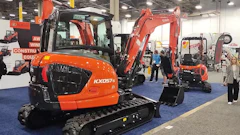 Orange Kubota excavators displayed at construction equipment trade show