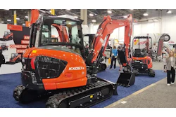 Orange Kubota excavators displayed at construction equipment trade show