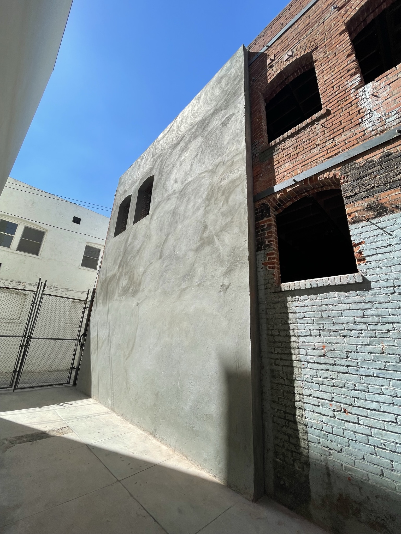 A shotcrete shear wall was installed at an existing building of unreinforced masonry for seismic strengthening.
