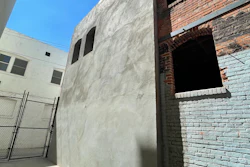 A shotcrete shear wall was installed at an existing building of unreinforced masonry for seismic strengthening.
