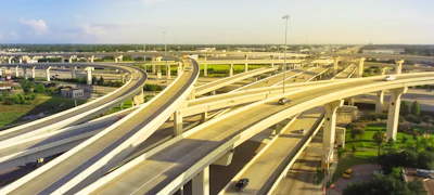 Panorama horizontal aerial view massive highway intersection, stack interchange blue sky in Houston, Texas, USA.