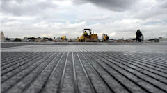 Grooves on a runway increase friction and reduce the risk of hydroplaning.