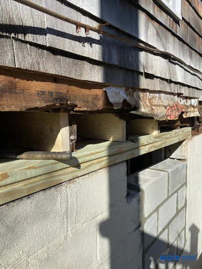 Figure 1. Rotted sill at the foundation, mid-replacement.