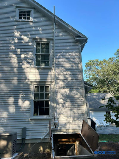 Figure 4. Exterior radon mitigation system on an older home.