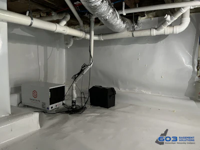 Figure 5. Crawlspace after encapsulation, vapor barrier and dehumidifier.