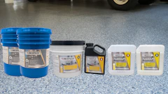 AmeriPolish concrete floor care products displayed in blue buckets and white containers on polished garage flooring