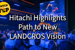 Hitachi industrial event presentation featuring robotic arm demonstration and audience in blue-lit venue with 'Watch FCP' branding