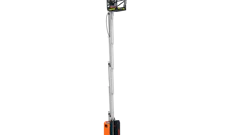 Orange and black vertical mast lift with extended boom platform for aerial work access
