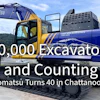 Komatsu excavator and branded truck celebrating 60,000 excavators milestone at 40th anniversary event in Chattanooga