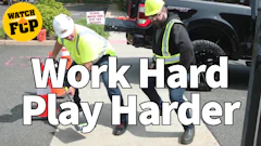 Construction workers in safety gear working on pavement with FCP watch logo overlay