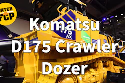 Yellow and blue Komatsu D175 Crawler Dozer on display at an indoor equipment showroom with 'WATCH FCP' badge overlay