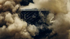 Volvo truck engulfed in dust clouds during high-speed off-road driving