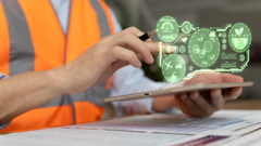 Construction worker in orange safety vest using tablet with green holographic sustainability and environmental monitoring icons