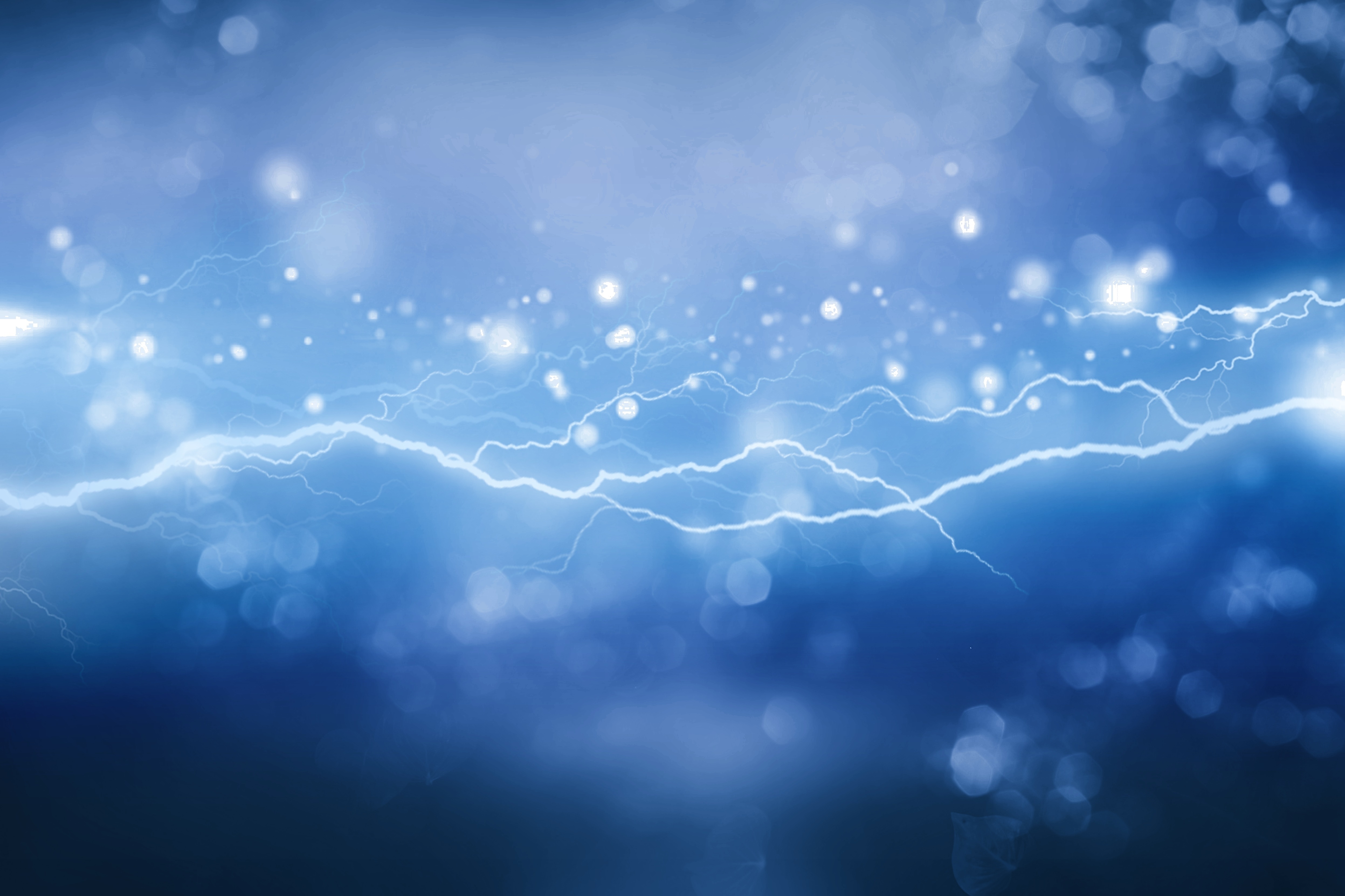 Blue abstract background with glowing lightning bolts and bokeh light particles