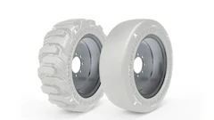 Two industrial tire wheels displayed side by side showing tread and smooth tire designs