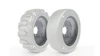 Two industrial tire wheels displayed side by side showing tread and smooth tire designs